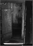 Outhouse interior with "Clean Hands" sign