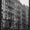 Tenements; residents on stoop