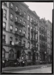 Tenements; residents on stoop