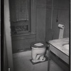 Bathroom interior with toilet and marble topped sink