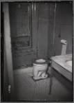 Bathroom interior with toilet and marble topped sink