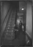 Interior stairwell; inspector with child