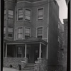Three story row house with porch