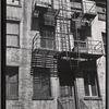 Brick row houses, rear view with stairs and fire escapes