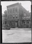 Wood frame building & Victorian houses; Climax Music Studio