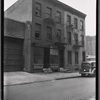 Tenement row with storefront; same block as #17273