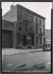 Tenement row with storefront; same block as #17273