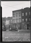 Row houses and storefronts; Ideal Barber Shop (So. Elmhurst Modern): 83-06 -12 [street unknown], Queens]
