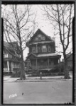 Shingled Victorian with porch and added on fire stairs: Queens?