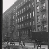 Tenement row with apartments to let; WPA road work: Manhattan