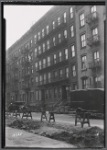 Tenement row with apartments to let; WPA road work: Manhattan