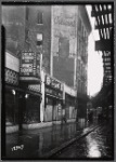 Strefronts & elevated train tracks; Checker Beverage Co, Sherbel's coats: 3112 [street unknown]]