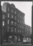 Tenements & storefronts; "Centennial Building," James Butler Groceries: Brooklyn