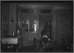 Old Law tenement kitchen interior with view of interior bedroom