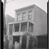 Three story stucco house with garage