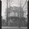 Victorian woodframe house with porch and for sale sign