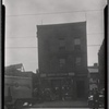 Storefront with upstairs apartments; Henry's Auto Body Works: 710 [street unknown], Bronx?]
