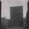 [Storefront with upstairs apartments; Henry's Auto Body Works: 710 [street unknown], Bronx?]