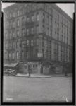 Tenement and storefronts; Rt NY 1A road sign: 1st Ave- E. 104th St., Manhattan