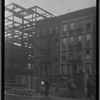 Tenement row; street excavation in progress
