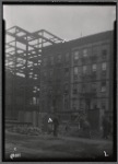 Tenement row; street excavation in progress