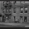 Apartment building, storefronts on ground floor; Bridge Mkt, Lea Lee Hairdressing: 831 W. 179th St.-Cabrini Blvd., Manhattan