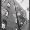 Tenement rear windows, fire escapes and laundry
