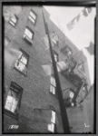 Tenement rear windows, fire escapes and laundry
