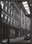 Tenements & storefronts; El tracks; Bishop's Crook lamp post