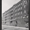Apartment building with beauty shop on first floor; A & P store: Bronx