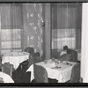Interior view of restaurant with table settings