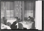 Interior view of restaurant with table settings