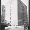 Apartment building; inspectors in street