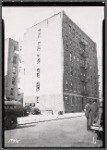 Apartment building; inspectors in street