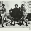 Unidentified musclemen in "Boys Talk" scene from Brand X