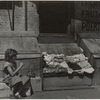 Park Avenue - Young girl selling clothes on the street, East Harlem, New York City