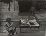 Park Avenue - Young girl selling clothes on the street, East Harlem, New York City