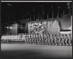 The Rockettes (background) and unidentified ice skaters (foreground) perform in the NBC-TV television special Rainbow of Stars
