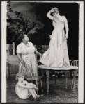 Johnny Doran [on floor], Theresa Merritt and Neva Small [on table] in the stage production F. Jasmine Addams