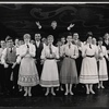Tommy Steele (with arms outstretched) and ensemble in the stage production Half a Sixpence