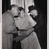 Elaine Stritch, Noël Coward, and restaurant owner Vincent Sardi in a promotional photograph in which they are pictured lighting the new electronic billboard for the original Broadway production of "Sail Away"