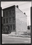 Vacant wood frame tenement with adjacent vacant lot : Queens?