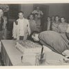 Montgomery Clift blowing out candles on cake
