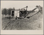 Mechanical digger working on cellar foundation at one of the housing units at the Berwyn project, [Greenbelt,] Maryland.