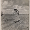 Mrs. Howard shows the beginning of a garden to a neighbor