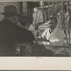 Interior of a grocery store showing the meat counter