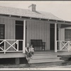 Irwinville Farms, Georgia. House of Charles Foster. Exterior [with] two children of client on porch