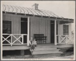 Irwinville Farms, Georgia. House of Charles Foster. Exterior [with] two children of client on porch