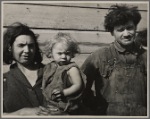 Mother and father and several children of a family of nine living in open field in rough board covering built on old Ford chassis on U.S. Route 70, between Bruceton and Camden, Tennessee. Their water supply was an open creek running near highway.