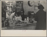 Interior of a grocery store showing the cheese and dairy counter